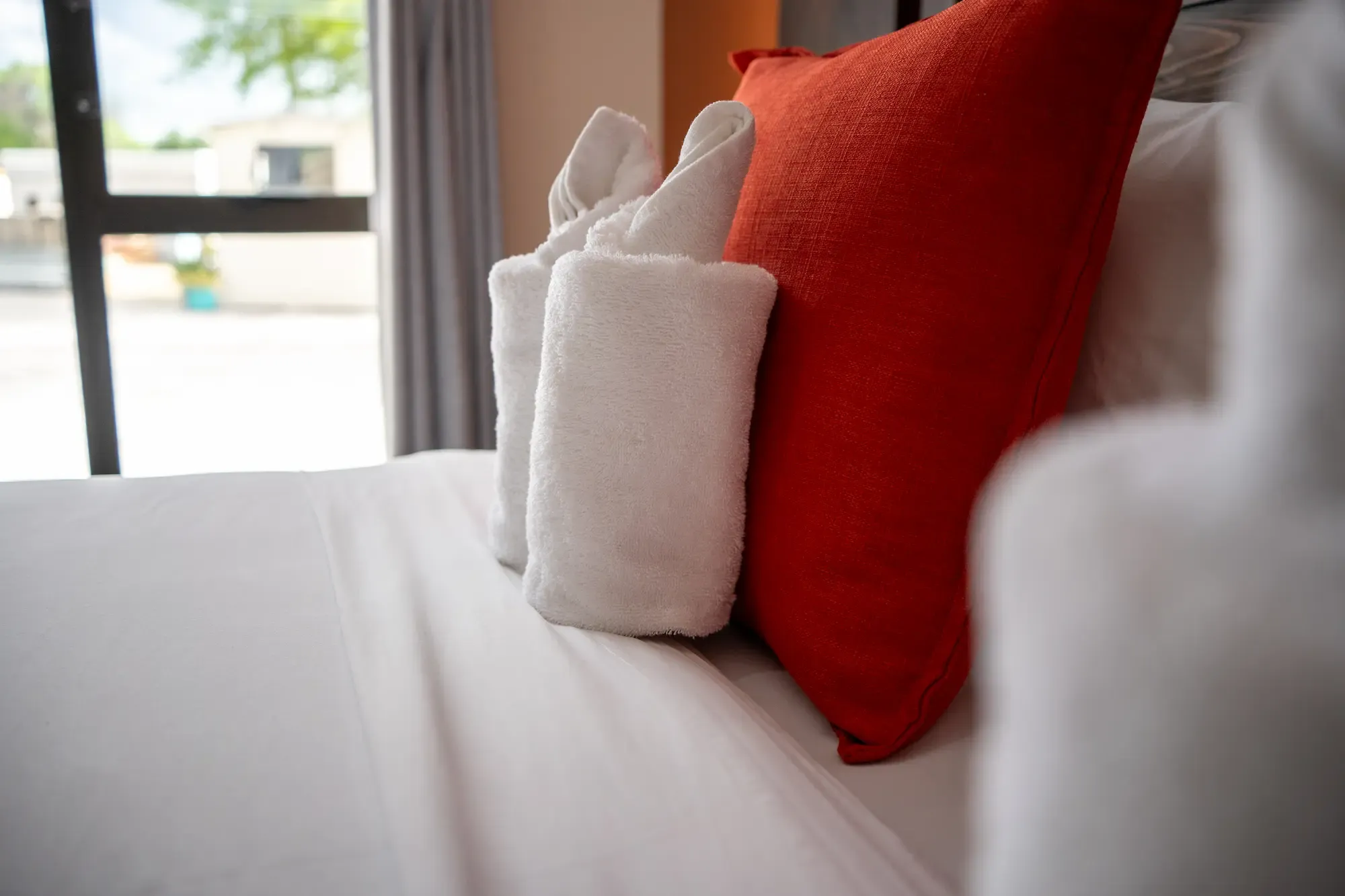 Folded towels on the bed